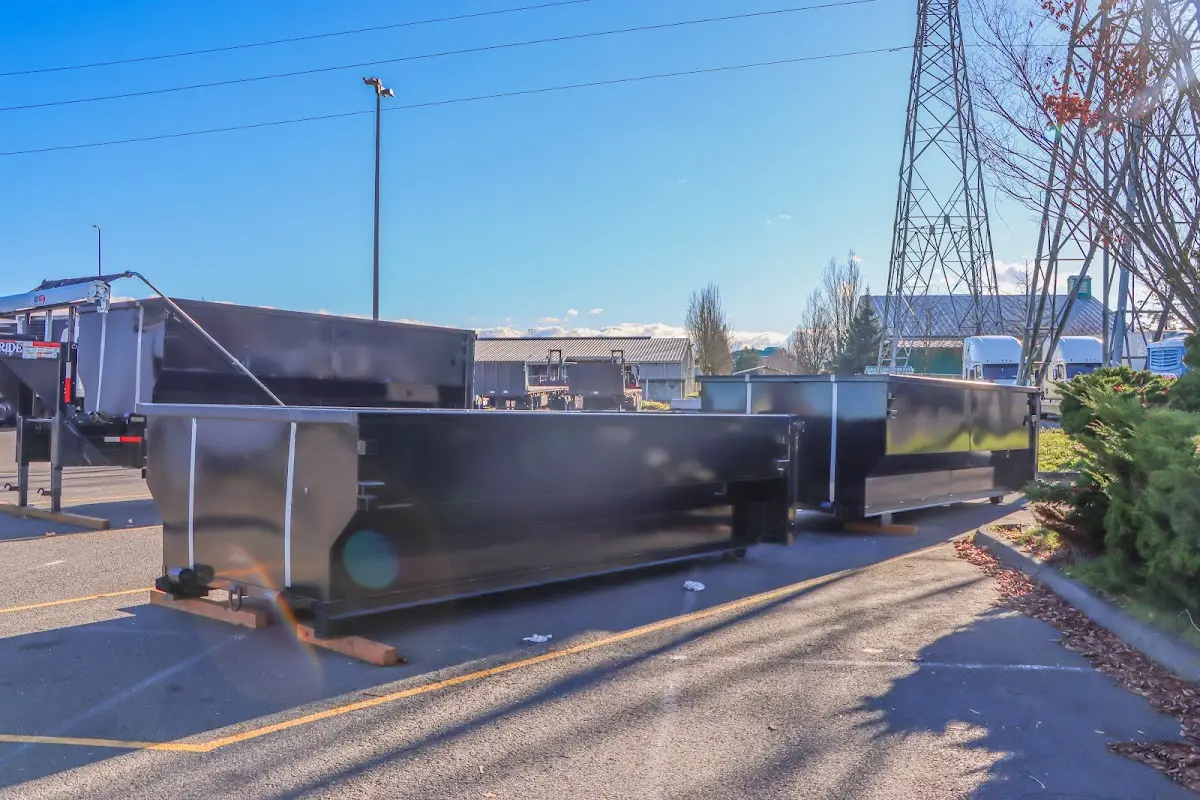 Roll-off dumpster ready for waste disposal at job site for Concrete Dumpster Rental in Valley City